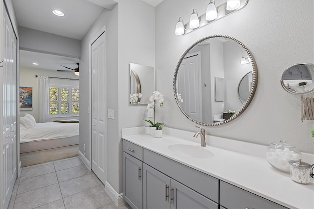 bathroom featuring ceiling fan, tile patterned flooring, and vanity