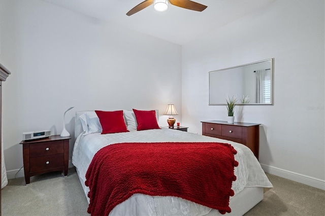 bedroom featuring ceiling fan and light carpet