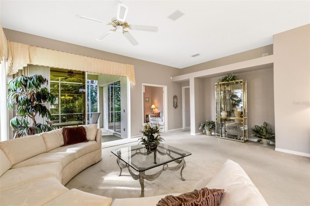 carpeted living room featuring ceiling fan