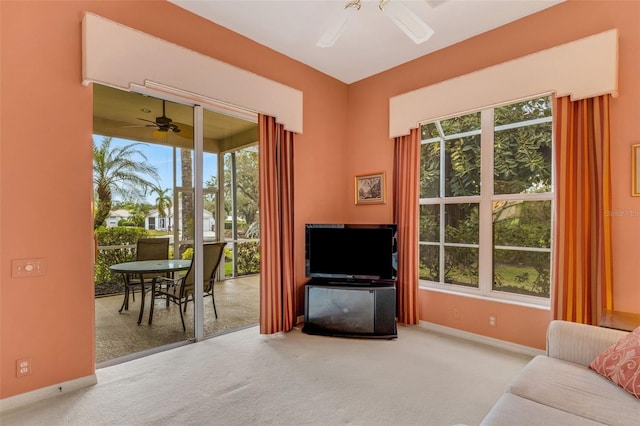 living room featuring ceiling fan and carpet floors