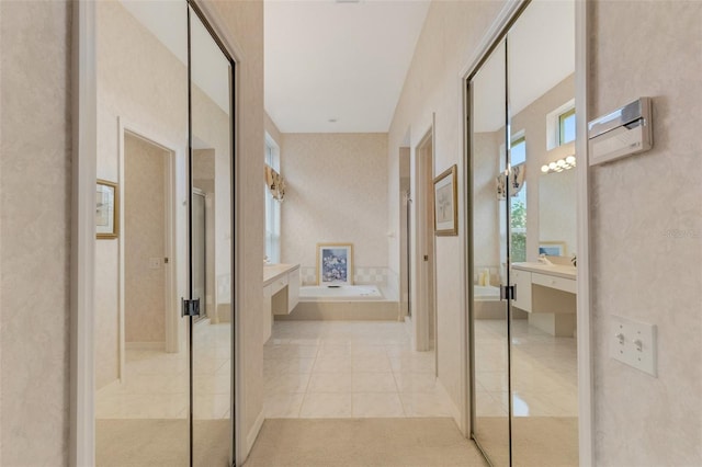 corridor featuring light tile patterned floors