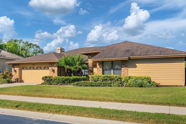 view of front facade featuring a front yard and a garage