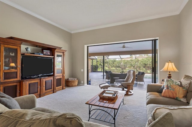 carpeted living room with ceiling fan and ornamental molding