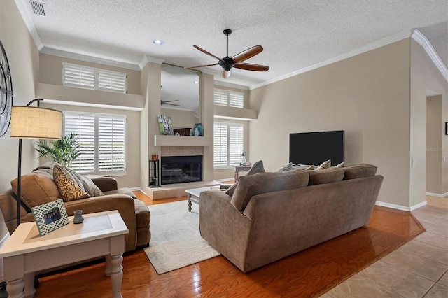 living room with ceiling fan, light hardwood / wood-style floors, and a healthy amount of sunlight