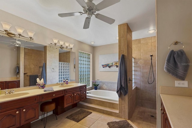 bathroom featuring tile patterned floors, vanity, ceiling fan, and shower with separate bathtub