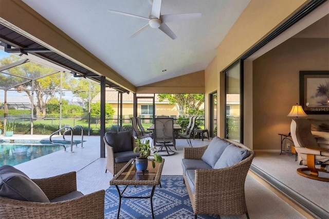 sunroom with a wealth of natural light, a swimming pool, ceiling fan, and lofted ceiling