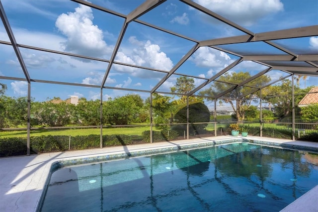 view of swimming pool with glass enclosure