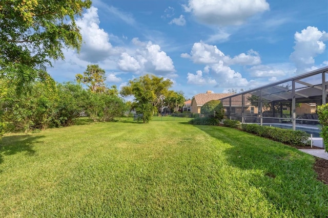 view of yard with a lanai