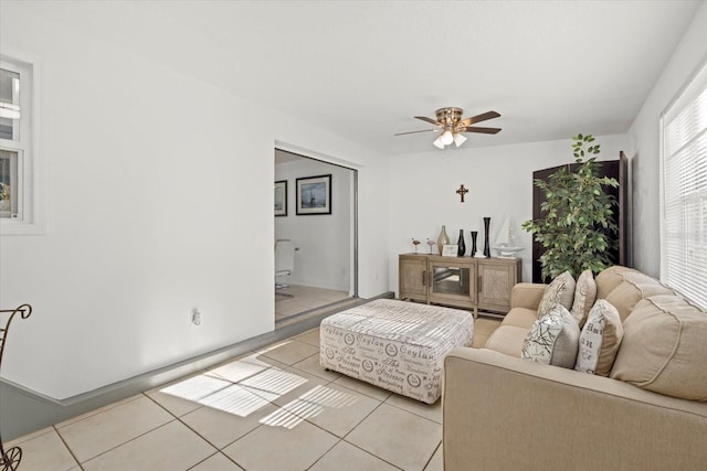 living room featuring ceiling fan and light tile patterned flooring