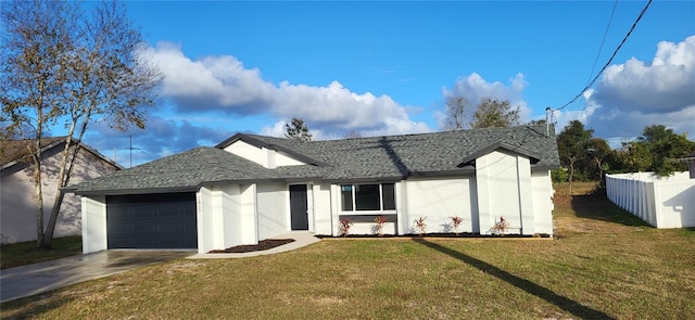 view of front of home with a garage and a front yard