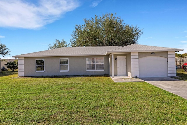 ranch-style house featuring a garage and a front lawn