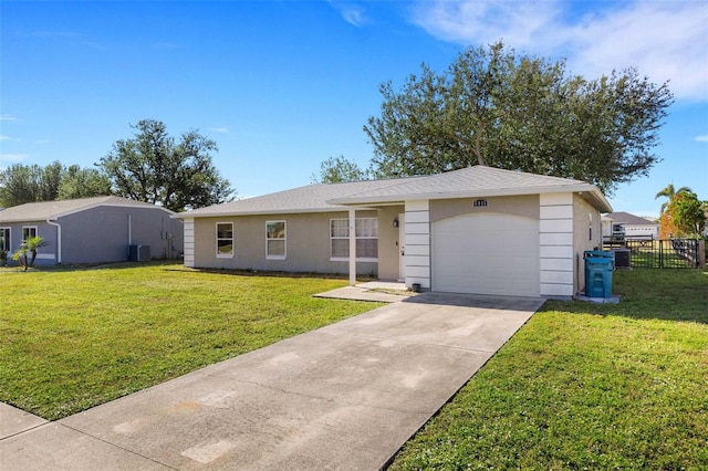 single story home with cooling unit, a front lawn, and a garage