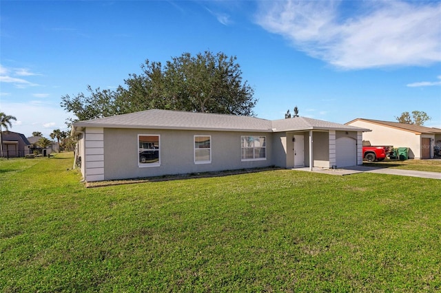 ranch-style home featuring a garage and a front lawn