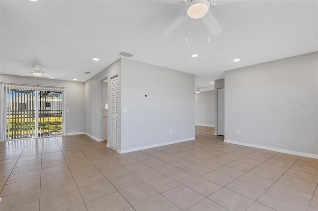 unfurnished room featuring ceiling fan and light tile patterned floors