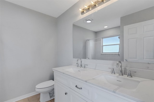 bathroom with toilet, vanity, tile patterned floors, and curtained shower