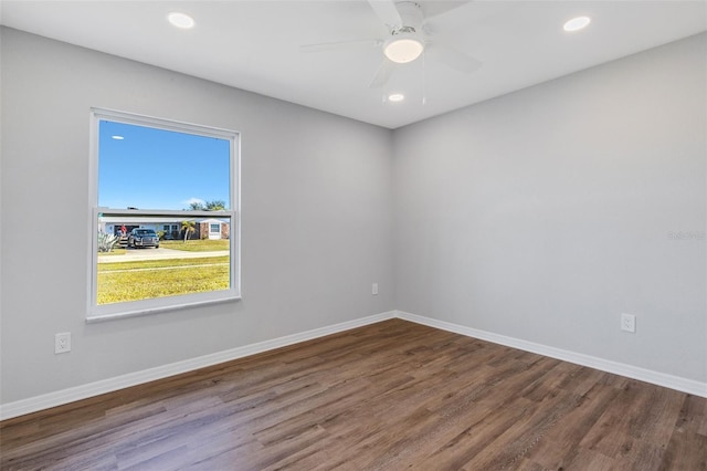 empty room with ceiling fan and wood-type flooring