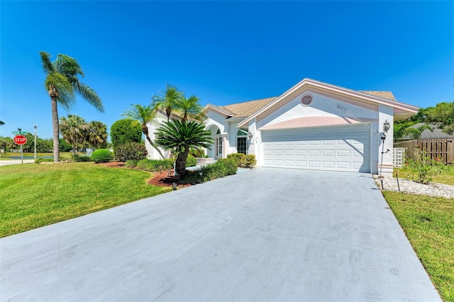 single story home with a garage and a front lawn