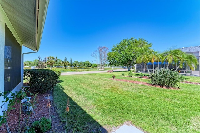 view of yard featuring a lanai