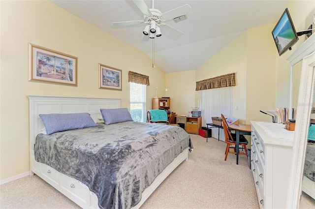 bedroom featuring a textured ceiling, ceiling fan, light colored carpet, and vaulted ceiling