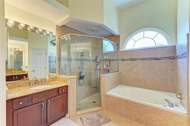 bathroom featuring separate shower and tub, tile patterned floors, and vanity