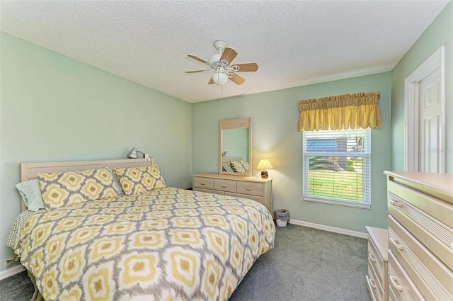 carpeted bedroom with ceiling fan and a textured ceiling