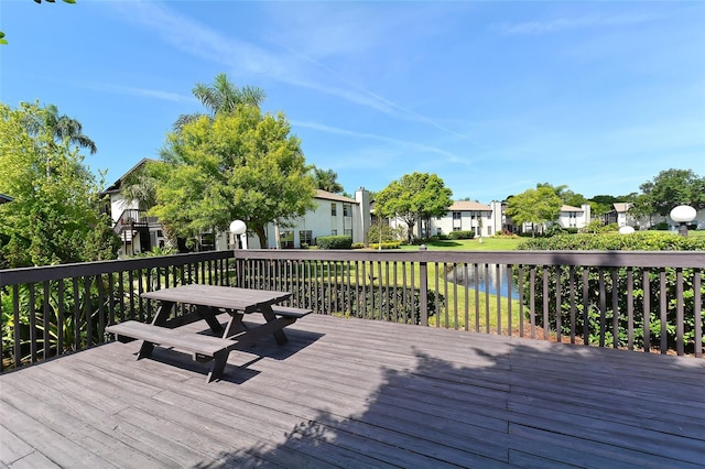 3609 59th Ave W Unit 4045, Bradenton, FL 34210 - wooden deck featuring a residential view, a water view, and outdoor dining area