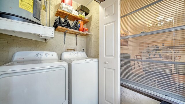 3609 59th Ave W Unit 4045, Bradenton, FL 34210 - washroom featuring washer and clothes dryer and a textured wall