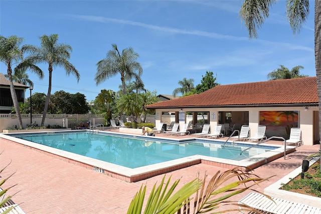 view of swimming pool with a patio