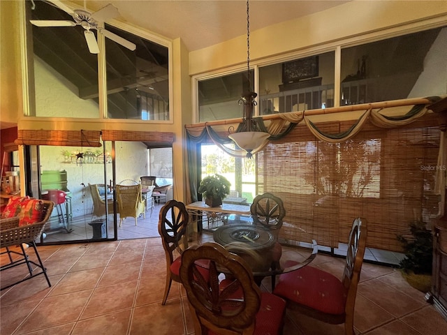 tiled dining area featuring ceiling fan