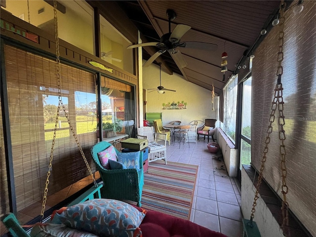 sunroom / solarium with vaulted ceiling and ceiling fan