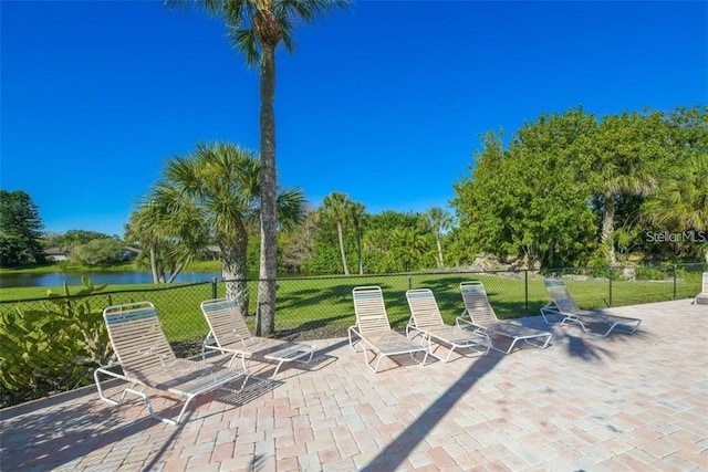 view of patio with a water view