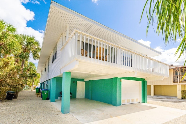 rear view of property featuring a garage