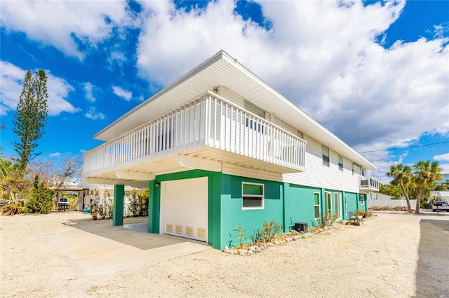 view of side of home featuring a garage