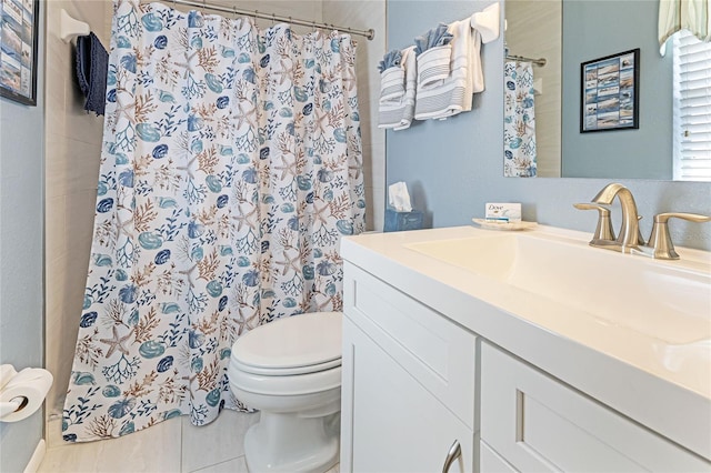 bathroom with vanity, a shower with shower curtain, and toilet