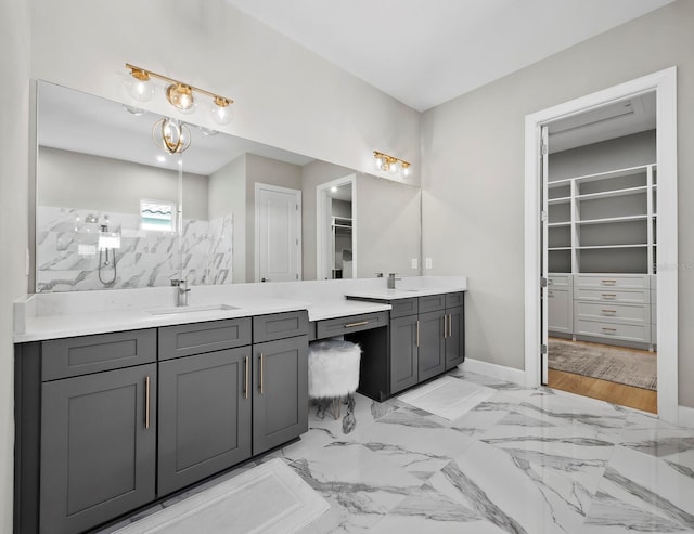 bathroom featuring a shower and vanity