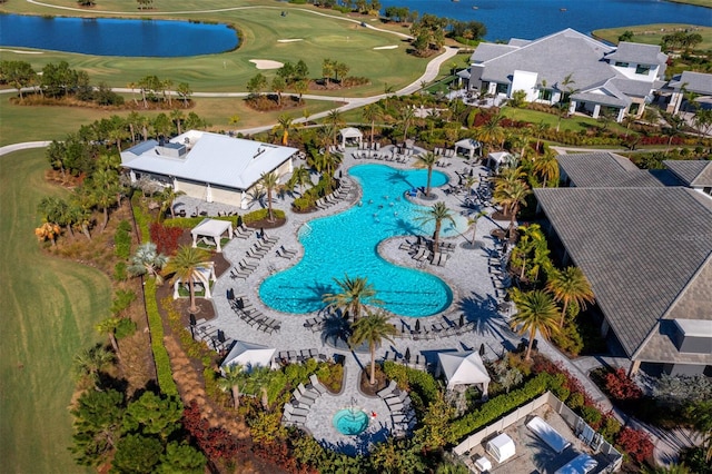 birds eye view of property with a water view