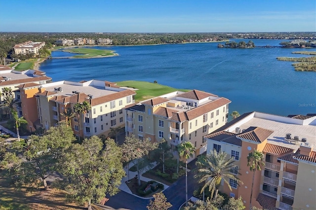 birds eye view of property featuring a water view