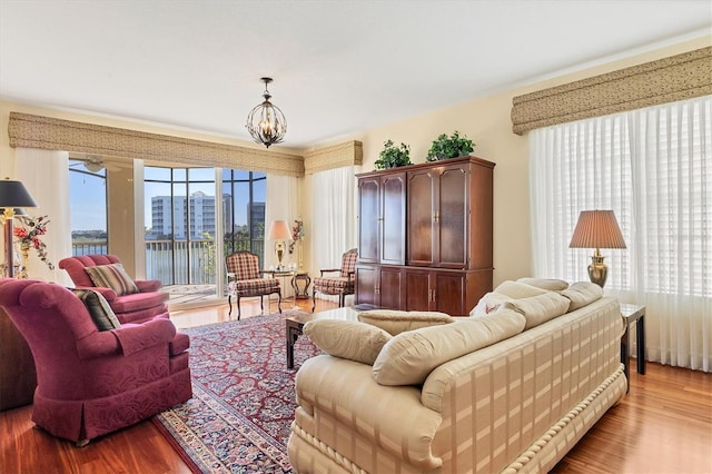 living room featuring light hardwood / wood-style flooring and a chandelier