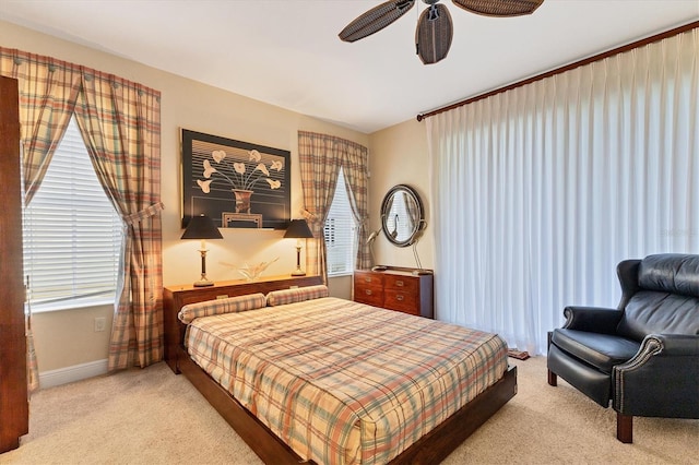 bedroom featuring ceiling fan and light carpet