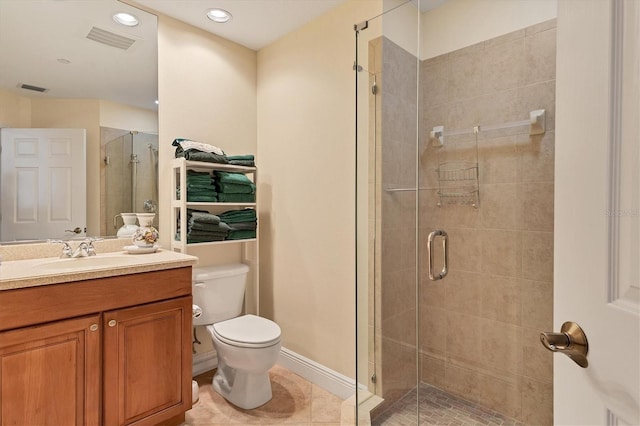 bathroom featuring tile patterned flooring, vanity, toilet, and an enclosed shower