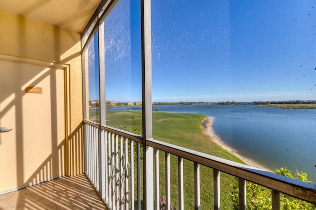 balcony featuring a water view