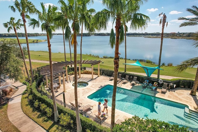 view of pool with a pergola, a water view, a hot tub, and a patio area