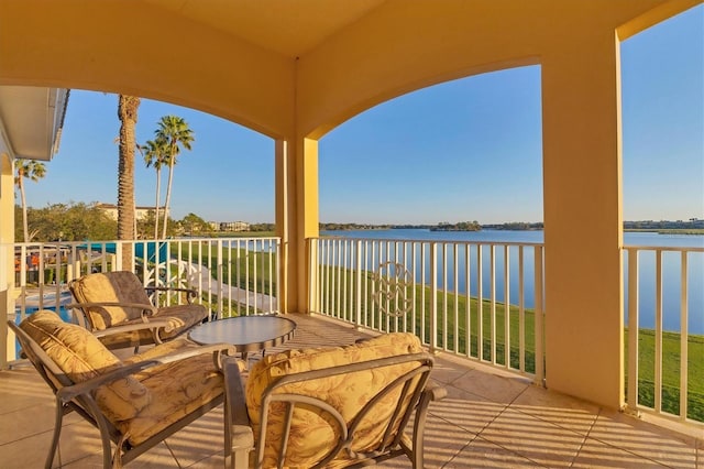 balcony featuring a water view