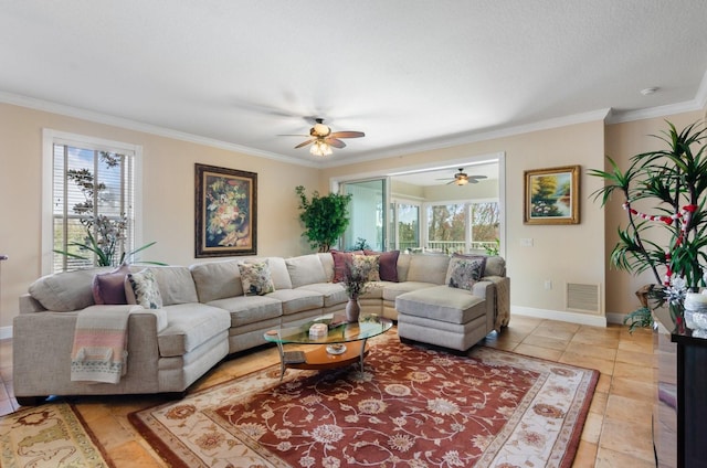 tiled living room with a textured ceiling, plenty of natural light, crown molding, and ceiling fan