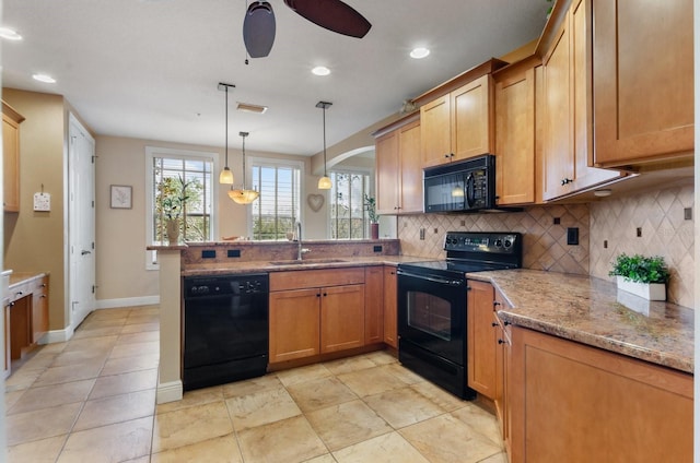 5209 Manorwood Dr Unit 3A, Sarasota, FL 34235 - kitchen with black appliances, a sink, a peninsula, decorative backsplash, and a ceiling fan