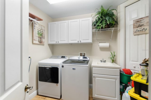 5209 Manorwood Dr Unit 3A, Sarasota, FL 34235 - laundry room featuring washer and dryer and cabinet space