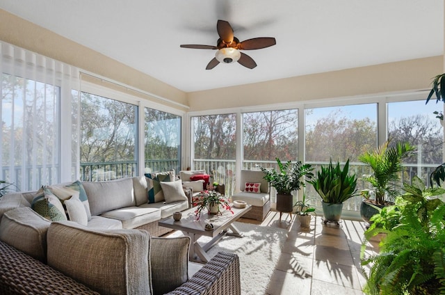 sunroom featuring ceiling fan