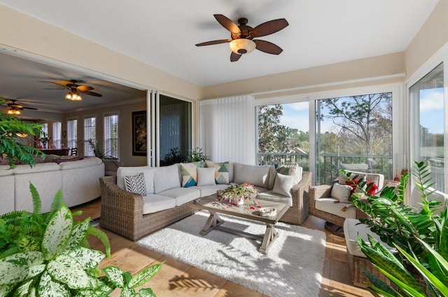 sunroom with plenty of natural light and ceiling fan