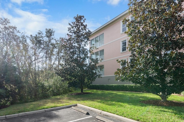 5209 Manorwood Dr Unit 3A, Sarasota, FL 34235 - view of building exterior featuring uncovered parking