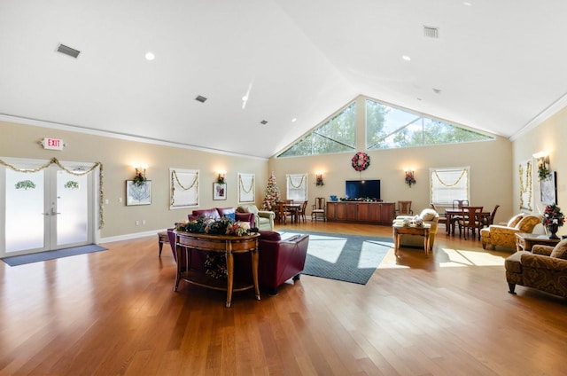 5209 Manorwood Dr Unit 3A, Sarasota, FL 34235 - living room featuring light wood-style floors, french doors, high vaulted ceiling, ornamental molding, and baseboards